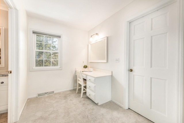 bathroom with baseboards, visible vents, carpet, and vanity