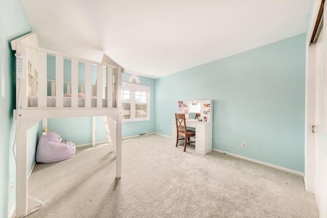 carpeted bedroom with baseboards