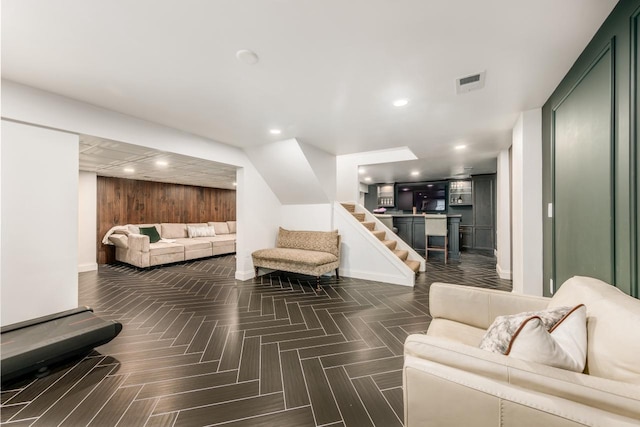 living area featuring recessed lighting, visible vents, baseboards, and stairs