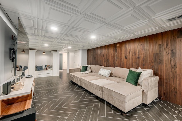 living room with recessed lighting, wooden walls, an ornate ceiling, and visible vents