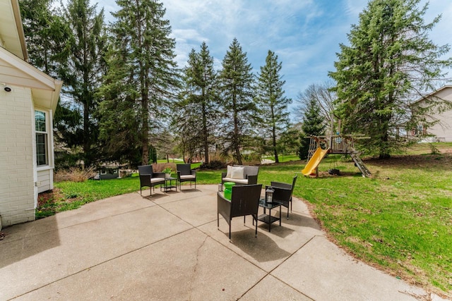 view of patio featuring a playground and an outdoor hangout area