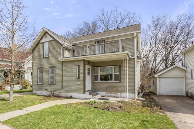 526 N Vine St, Appleton, WI 54911 - traditional-style house with a detached garage, a balcony, concrete driveway, entry steps, and a front yard