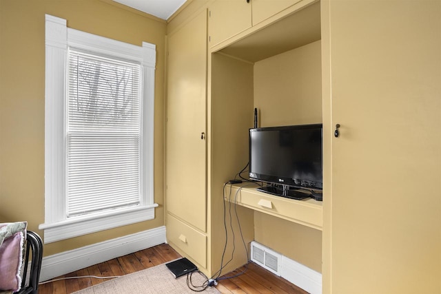 526 N Vine St, Appleton, WI 54911 - living room with baseboards, wood finished floors, and visible vents