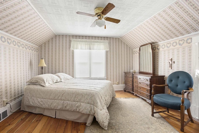 526 N Vine St, Appleton, WI 54911 - bedroom featuring vaulted ceiling, visible vents, hardwood / wood-style flooring, and ceiling fan