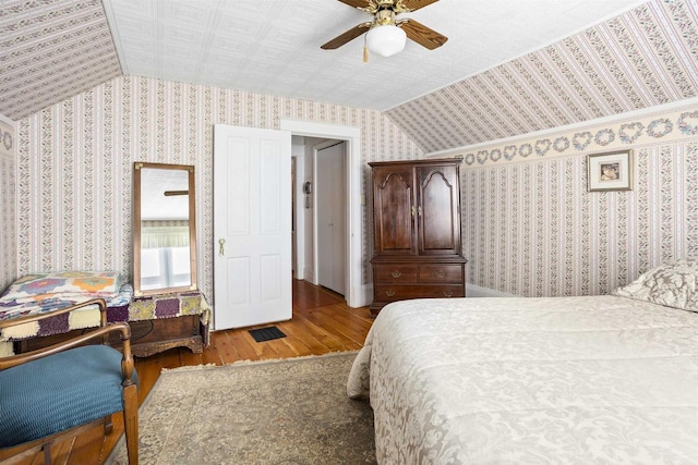 526 N Vine St, Appleton, WI 54911 - bedroom featuring lofted ceiling, a ceiling fan, hardwood / wood-style floors, and wallpapered walls