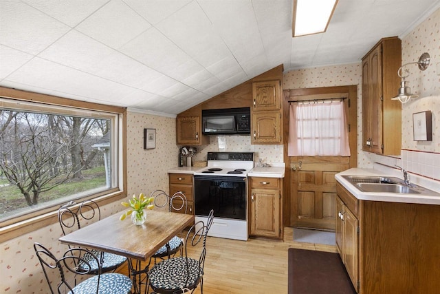 526 N Vine St, Appleton, WI 54911 - kitchen with wallpapered walls, light wood finished floors, a sink, white range with electric cooktop, and black microwave
