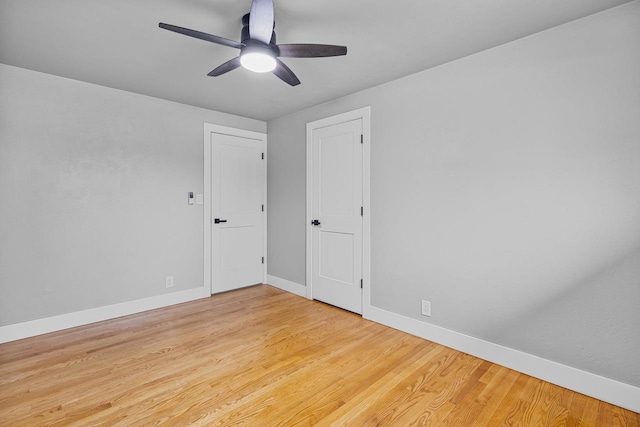 unfurnished bedroom featuring baseboards, a ceiling fan, and wood finished floors