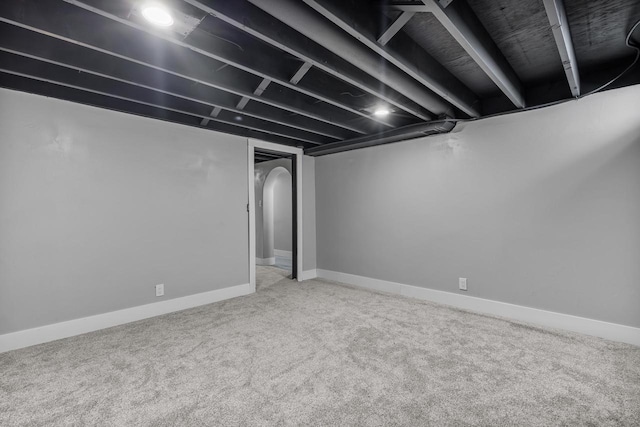 finished basement featuring carpet flooring and baseboards