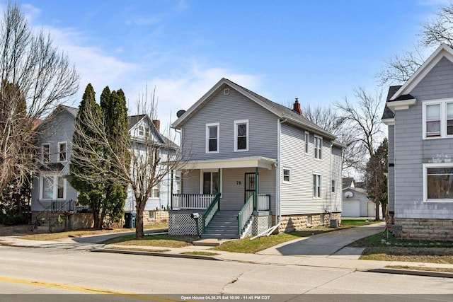 76 E Johnson St, Fond Du Lac, WI 54935 - traditional style home featuring an outbuilding, covered porch, and a chimney