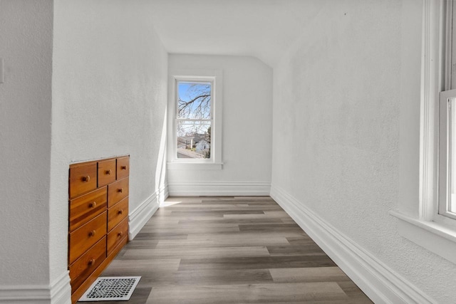 76 E Johnson St, Fond Du Lac, WI 54935 - interior space featuring baseboards, wood finished floors, visible vents, and a textured wall