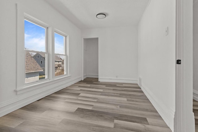 76 E Johnson St, Fond Du Lac, WI 54935 - empty room featuring baseboards and wood finished floors