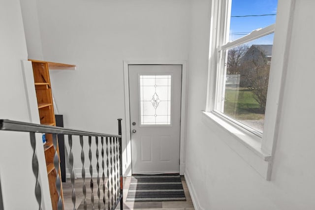 76 E Johnson St, Fond Du Lac, WI 54935 - doorway to outside with baseboards and a healthy amount of sunlight