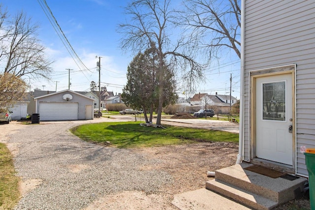 76 E Johnson St, Fond Du Lac, WI 54935 - view of yard featuring an outbuilding and a garage
