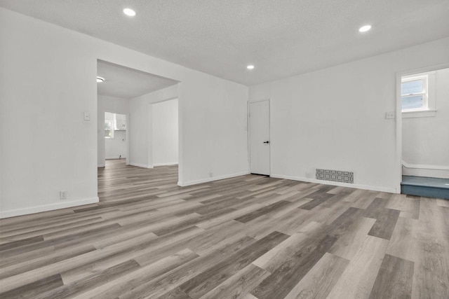 76 E Johnson St, Fond Du Lac, WI 54935 - spare room with baseboards, wood finished floors, visible vents, and recessed lighting