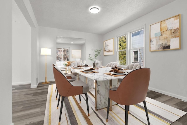 76 E Johnson St, Fond Du Lac, WI 54935 - dining area featuring a wealth of natural light, wood finished floors, and baseboards