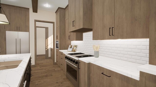 W2600 Oakwood Beach Rd, Markesan, WI 53946 - kitchen featuring tasteful backsplash, light stone countertops, stainless steel range, light wood finished floors, and a sink