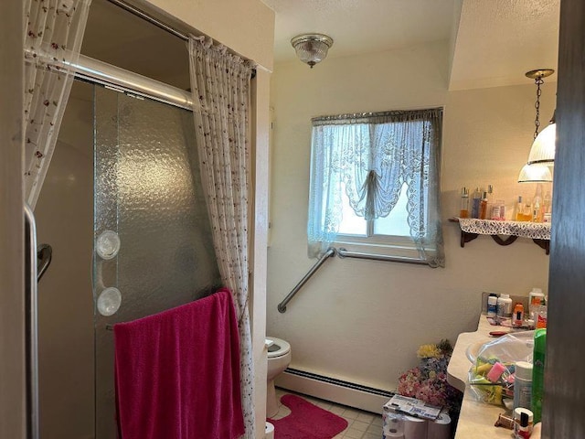 bathroom featuring a shower stall, a baseboard radiator, and toilet