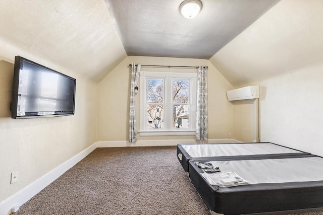 1931 Wood St, La Crosse, WI 54603 - interior space with vaulted ceiling, carpet flooring, a wall mounted AC, and baseboards
