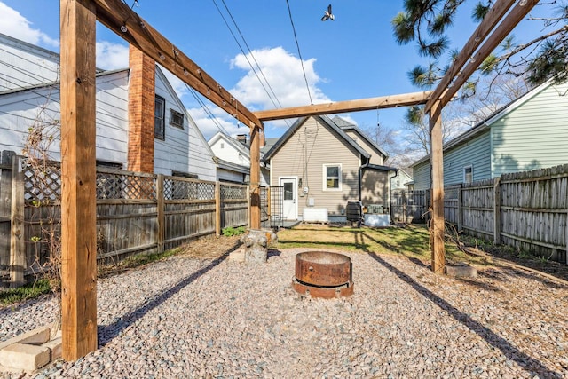 1931 Wood St, La Crosse, WI 54603 - back of property featuring a fenced backyard and an outdoor fire pit