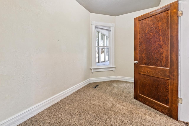 1931 Wood St, La Crosse, WI 54603 - carpeted empty room featuring visible vents and baseboards