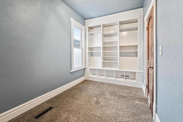 1931 Wood St, La Crosse, WI 54603 - spare room featuring baseboards, a textured wall, carpet flooring, and visible vents
