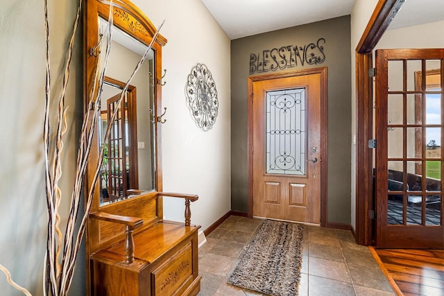 foyer entrance with baseboards