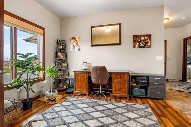 office with dark wood finished floors and baseboards
