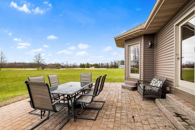 view of patio with entry steps and outdoor dining area
