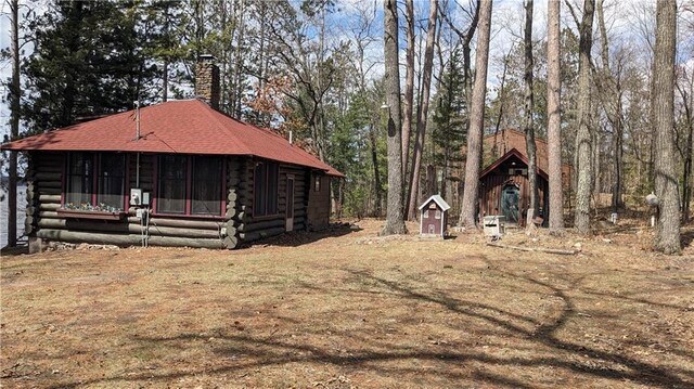 6051 Elsie Rd, Stone Lake, WI 54876 - view of yard featuring a sunroom