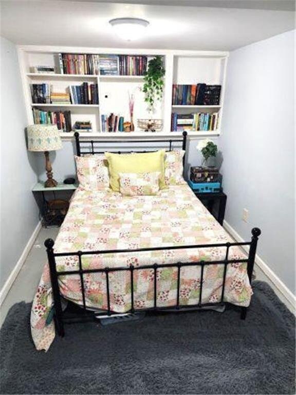 21 N Main St, Luck, WI 54853 - carpeted bedroom featuring baseboards
