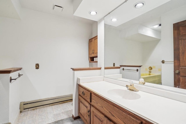 full bathroom with visible vents, a garden tub, vanity, recessed lighting, and a baseboard radiator