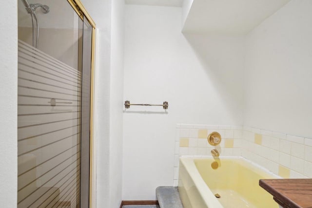 full bath featuring a bath and a stall shower
