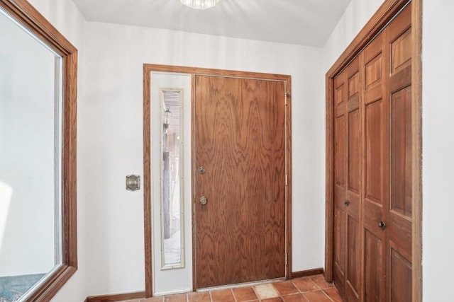entryway featuring baseboards