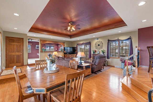 dining room featuring ceiling fan, baseboards, recessed lighting, and a raised ceiling