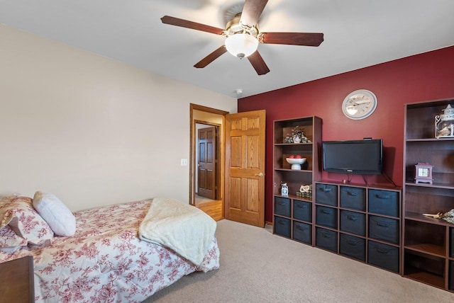 carpeted bedroom featuring a ceiling fan