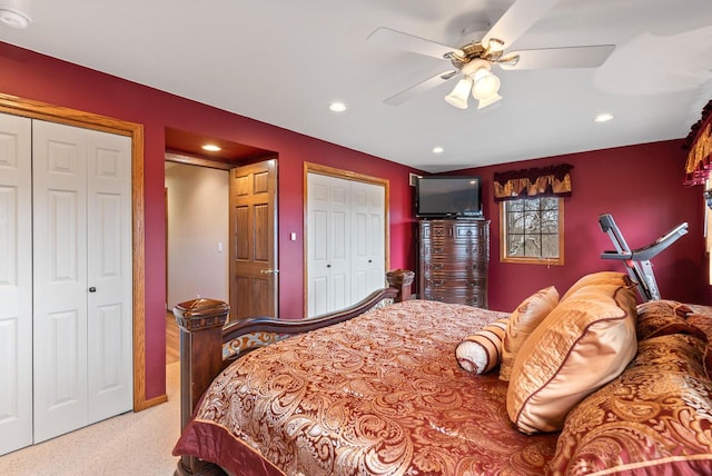 carpeted bedroom with multiple closets, recessed lighting, and a ceiling fan