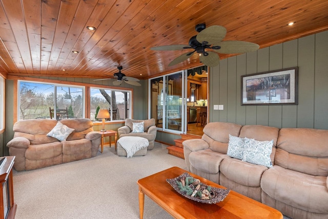carpeted living area featuring recessed lighting, wood ceiling, and ceiling fan