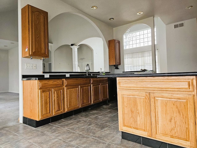 1835 N Davies Dr, Summit, WI 53066 - kitchen featuring recessed lighting, dark countertops, visible vents, and decorative columns
