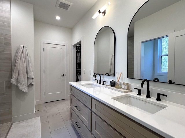 3156 Breeze Dr, Sun Prairie, WI 53590 - bathroom featuring tile patterned floors, a sink, visible vents, and double vanity