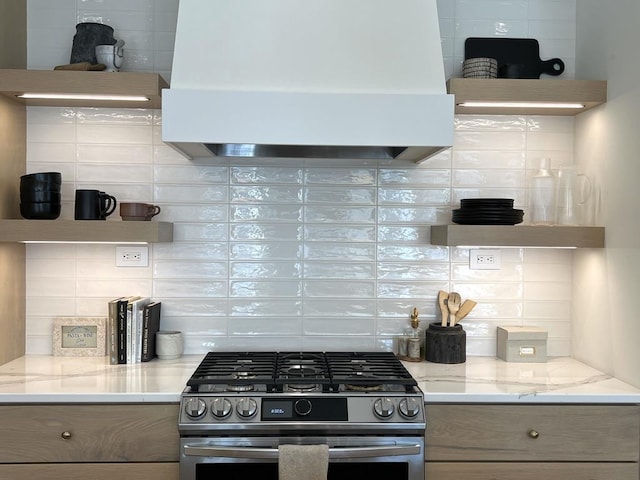 3156 Breeze Dr, Sun Prairie, WI 53590 - kitchen with backsplash, stainless steel range with gas stovetop, open shelves, and exhaust hood