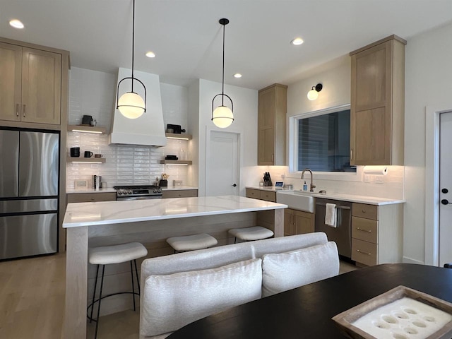 3156 Breeze Dr, Sun Prairie, WI 53590 - kitchen featuring stainless steel appliances, a sink, decorative backsplash, range hood, and open shelves