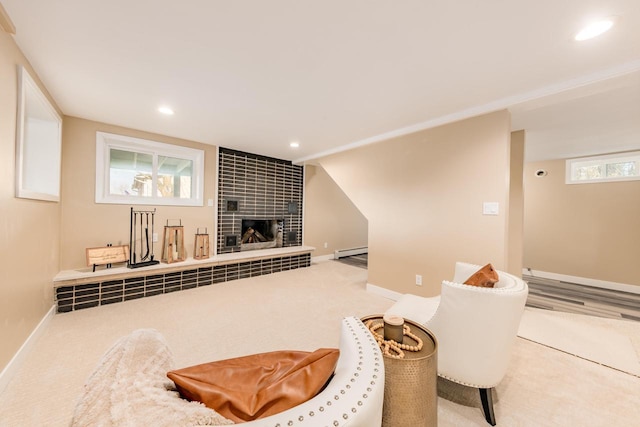 W2252 Spring Lake Rd, Markesan, WI 53946 - carpeted living area featuring baseboard heating, baseboards, recessed lighting, and a tiled fireplace