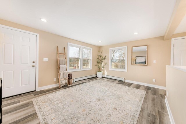 W2252 Spring Lake Rd, Markesan, WI 53946 - interior space with baseboards, wood finished floors, recessed lighting, and a baseboard radiator