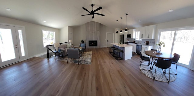 365 13th Dr, Nekoosa, WI 54457 - living area with wood finished floors, vaulted ceiling, a ceiling fan, baseboards, and recessed lighting