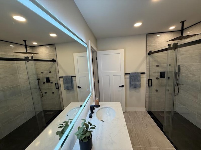 365 13th Dr, Nekoosa, WI 54457 - bathroom featuring a shower stall, vanity, baseboards, and recessed lighting