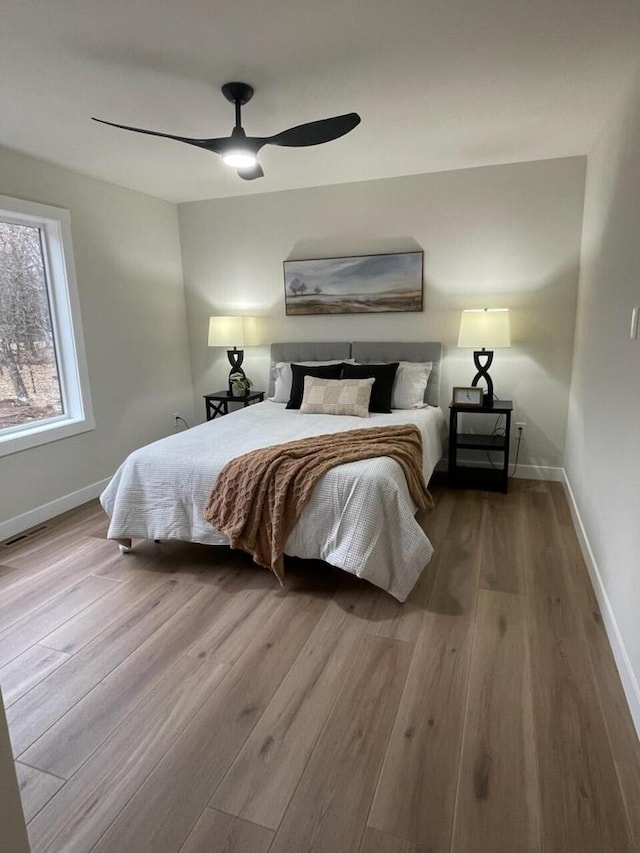 365 13th Dr, Nekoosa, WI 54457 - bedroom with wood finished floors, baseboards, and a ceiling fan