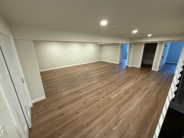 365 13th Dr, Nekoosa, WI 54457 - finished basement featuring stairs, recessed lighting, baseboards, and wood finished floors