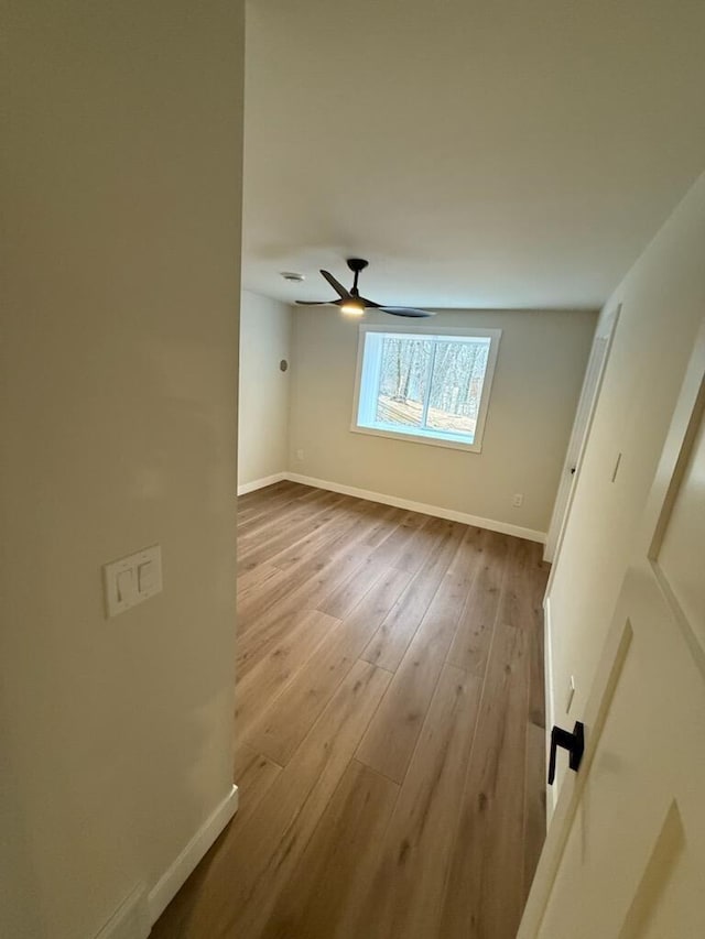 365 13th Dr, Nekoosa, WI 54457 - empty room featuring baseboards, wood finished floors, and ceiling fan