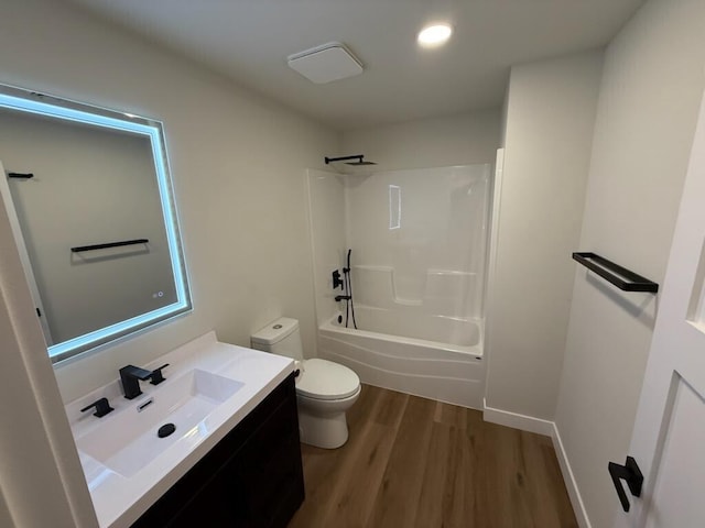 365 13th Dr, Nekoosa, WI 54457 - full bathroom featuring toilet, vanity, wood finished floors, shower / bathtub combination, and recessed lighting