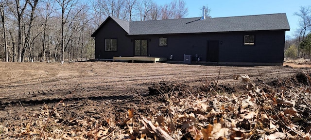 365 13th Dr, Nekoosa, WI 54457 - rear view of house with a wooden deck and a shingled roof
